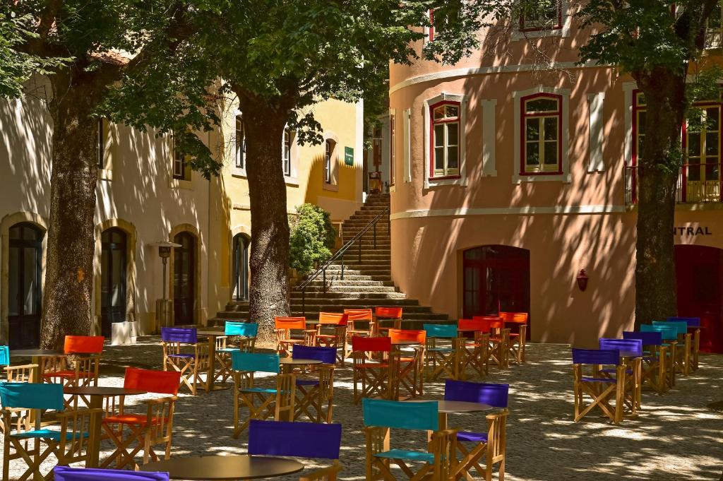 Quiet courtyard with chairs and trees in Monchique